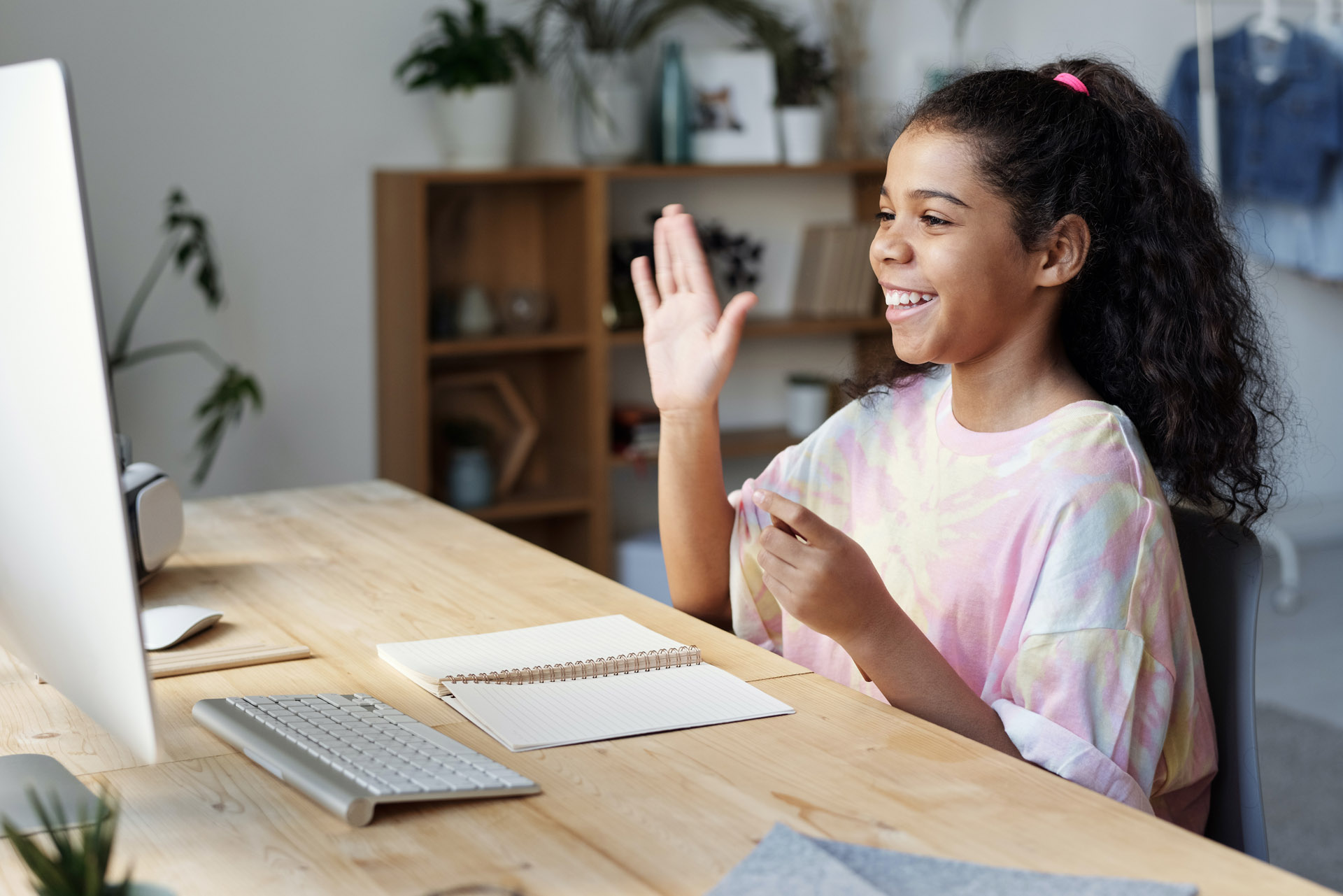 Young girl participating in online class