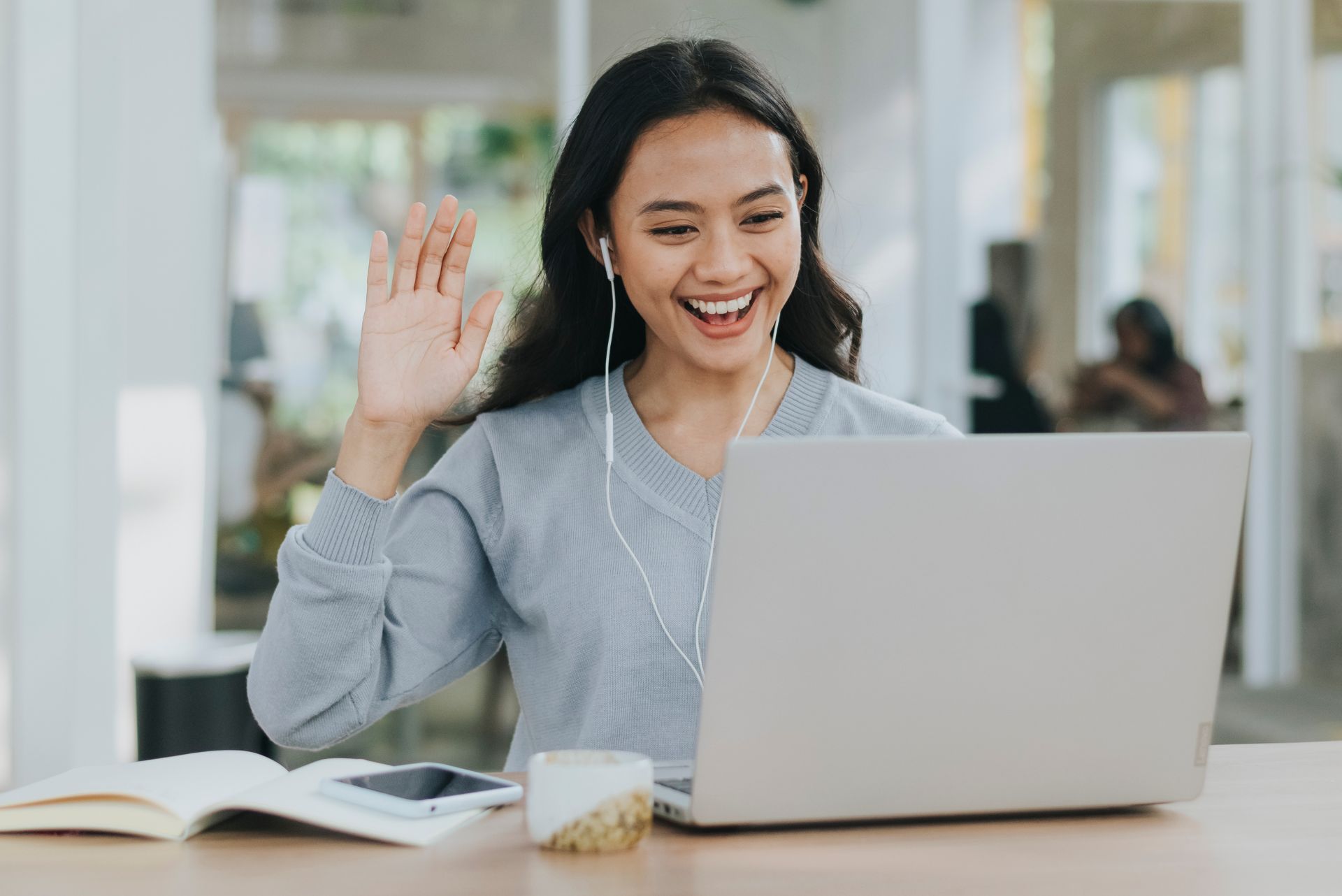 Online teacher working at laptop
