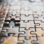 Close-up of puzzle missing one piece