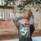 kid shooting a basketball